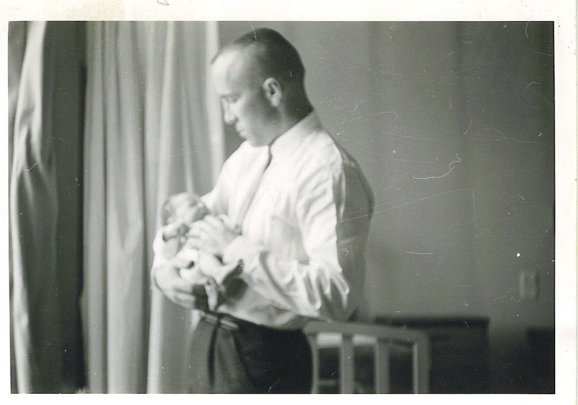 Serviceman with adult companion in mid-century attire